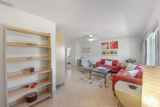 tiled living room with ceiling fan