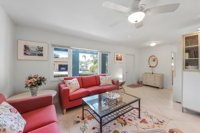 living room featuring light tile patterned flooring and ceiling fan