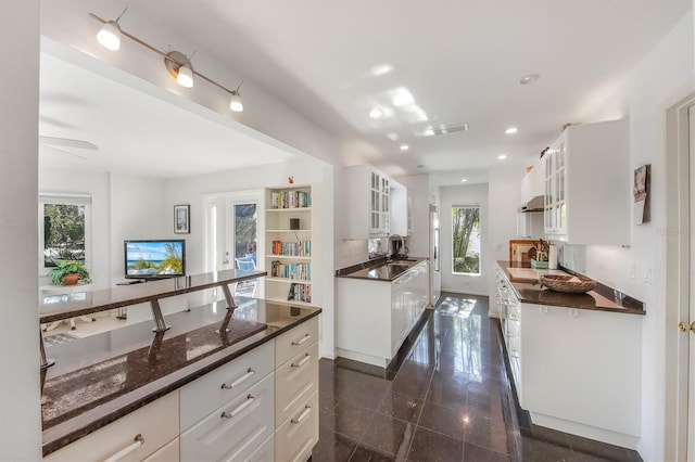 kitchen with white cabinetry and sink