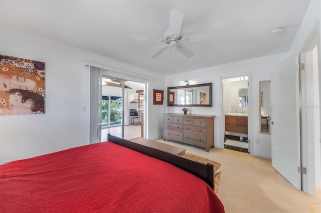 bedroom featuring ceiling fan, ensuite bathroom, light carpet, and access to outside