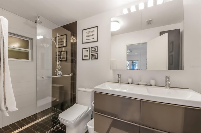 bathroom with vanity, an enclosed shower, and toilet