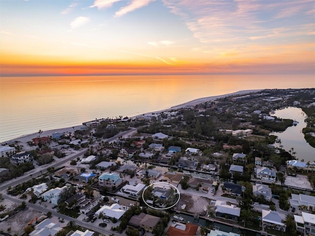 aerial view at dusk with a water view