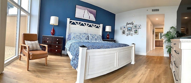 bedroom with light hardwood / wood-style floors