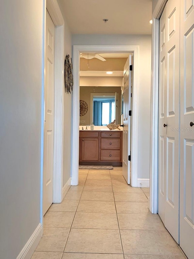 corridor with light tile patterned floors