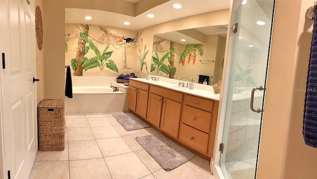 bathroom with tile patterned flooring, shower with separate bathtub, and vanity