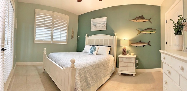 bedroom featuring ceiling fan and light tile patterned floors