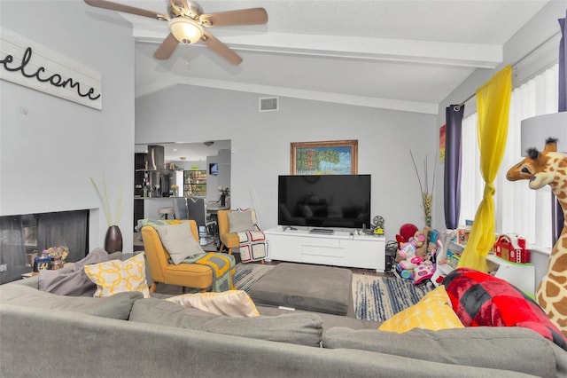 living room featuring lofted ceiling with beams and ceiling fan