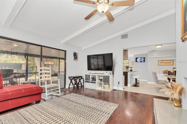 living room with lofted ceiling with beams, hardwood / wood-style flooring, and ceiling fan