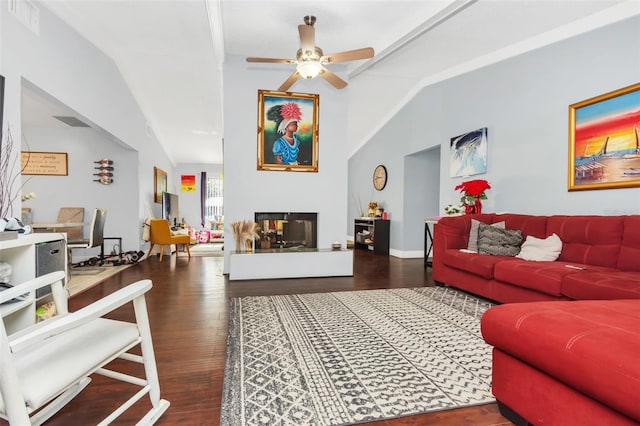 living room with a multi sided fireplace, lofted ceiling, dark wood-type flooring, and ceiling fan