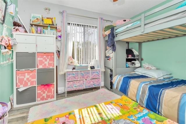 bedroom with wood-type flooring