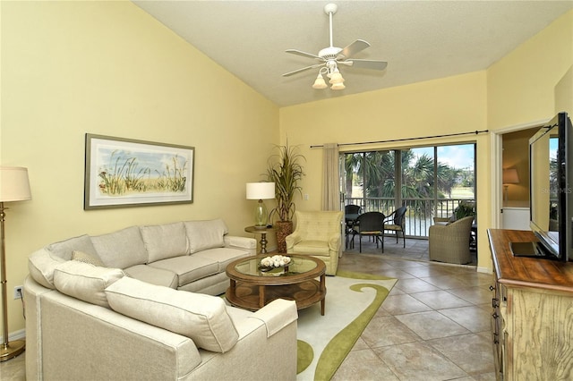 living room featuring light tile patterned floors, high vaulted ceiling, and ceiling fan