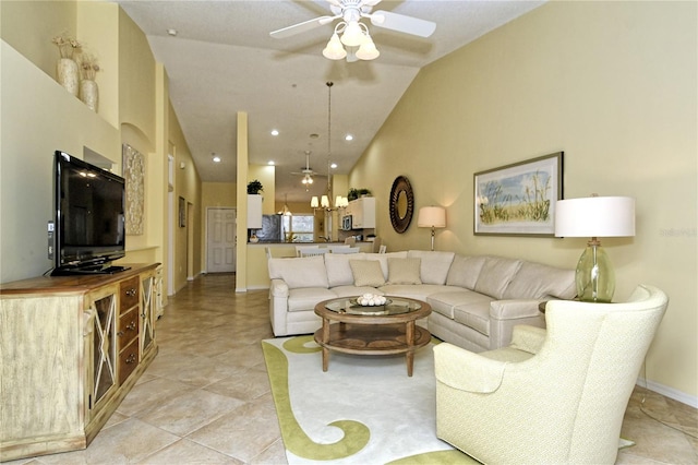 living room featuring ceiling fan and high vaulted ceiling