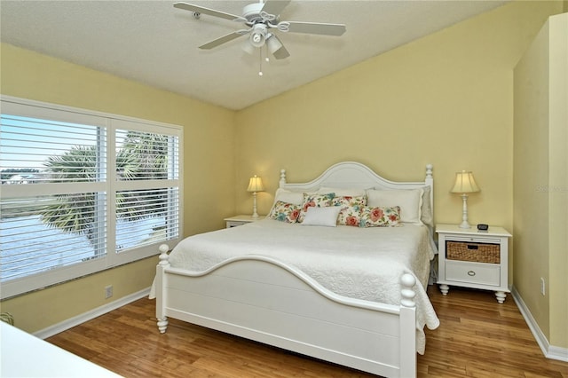 bedroom featuring wood-type flooring and ceiling fan