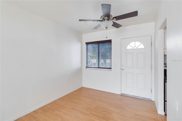 foyer featuring ceiling fan and light wood-type flooring