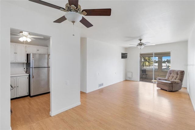 unfurnished living room with light hardwood / wood-style flooring