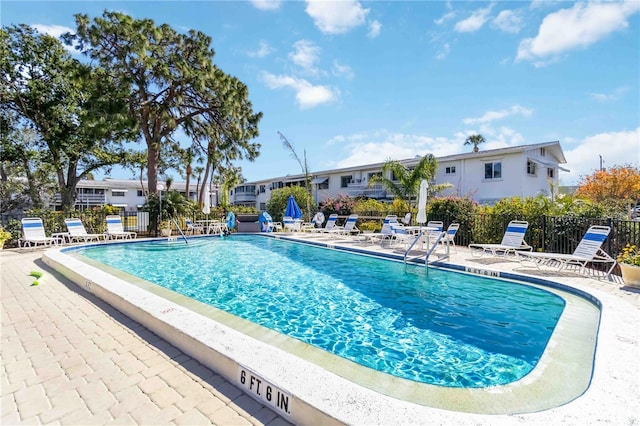 view of swimming pool with a patio