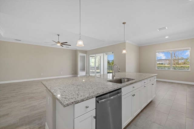 kitchen with white cabinetry, sink, stainless steel dishwasher, and hanging light fixtures