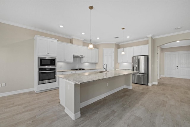 kitchen with white cabinetry, an island with sink, stainless steel appliances, and sink