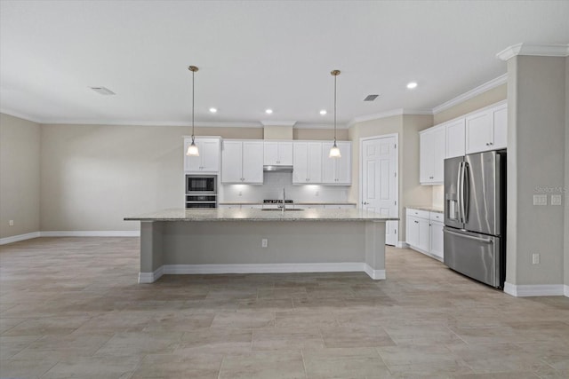 kitchen with hanging light fixtures, a center island with sink, white cabinets, and appliances with stainless steel finishes