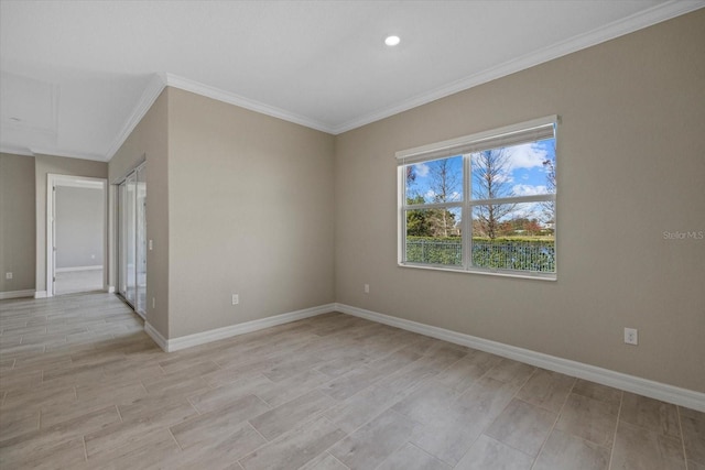 unfurnished room with crown molding and light hardwood / wood-style flooring