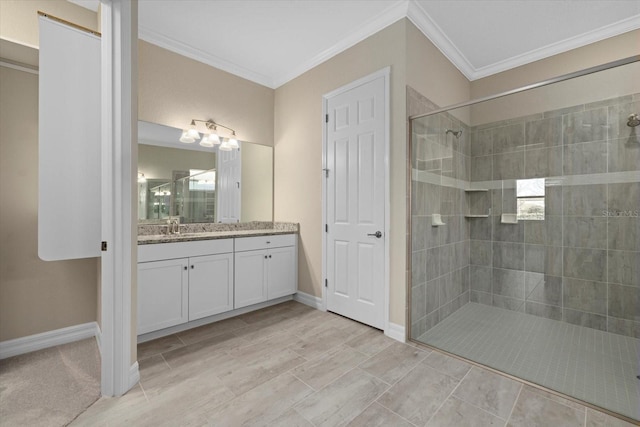 bathroom with vanity, tiled shower, and crown molding