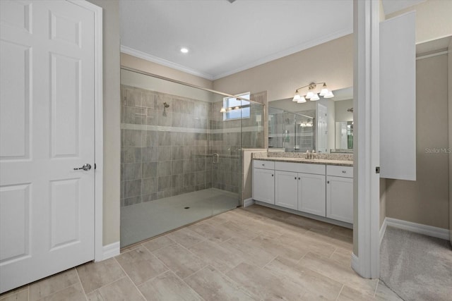 bathroom with vanity, ornamental molding, and a shower with shower door