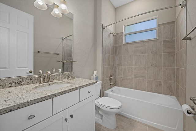 full bathroom featuring vanity, toilet, and tiled shower / bath combo