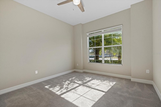 unfurnished room featuring ceiling fan and light carpet