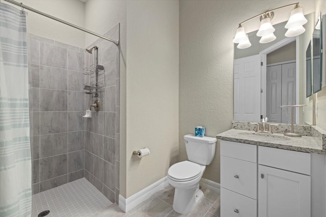 bathroom with vanity, toilet, and curtained shower