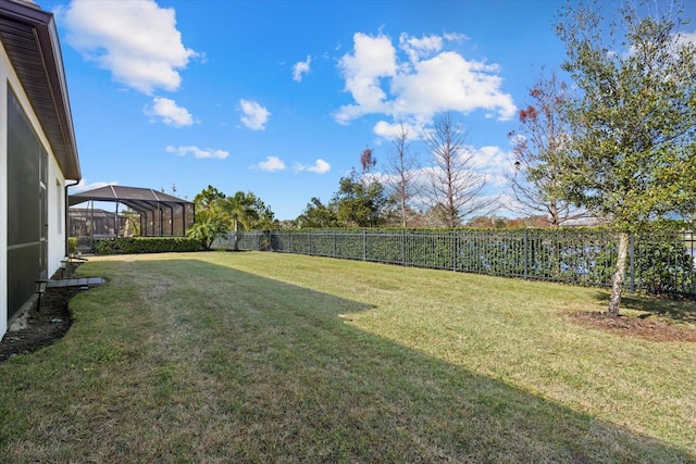 view of yard with a lanai