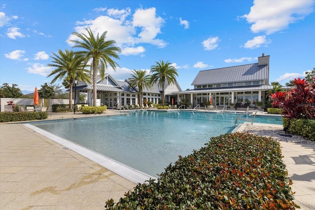 view of swimming pool with a patio