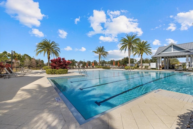 view of swimming pool with a gazebo and a patio area