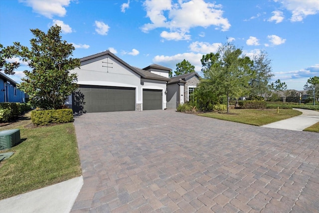 12029 Perennial Pl, Lakewood Ranch, FL 34211 - ranch-style house featuring stucco siding, driveway, an attached garage, and a front lawn