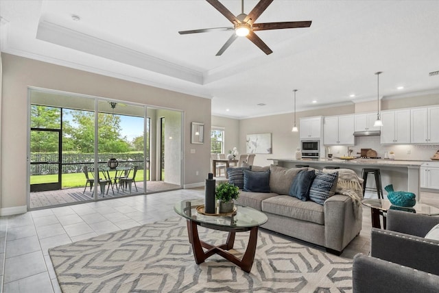 12029 Perennial Pl, Lakewood Ranch, FL 34211 - living room with baseboards, ceiling fan, light tile patterned flooring, crown molding, and recessed lighting