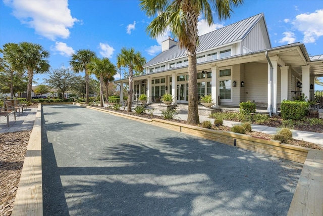 12029 Perennial Pl, Lakewood Ranch, FL 34211 - exterior space with metal roof, a standing seam roof, and a chimney