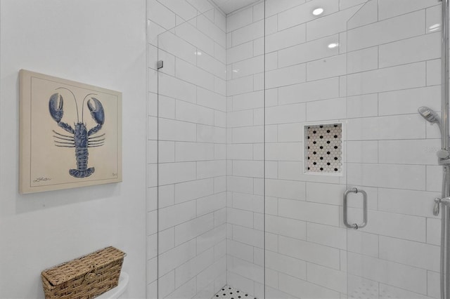 bathroom with a shower stall