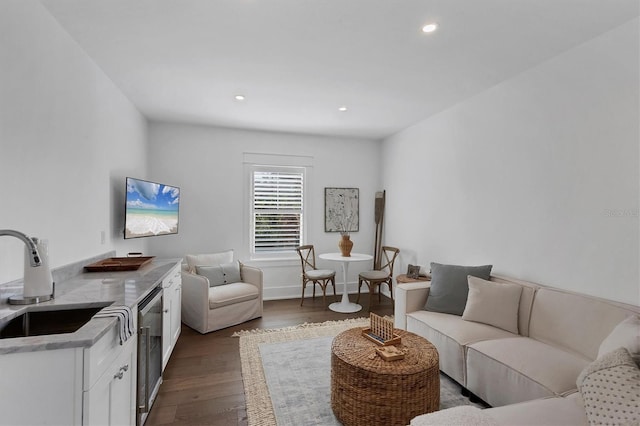 living room featuring dark wood-type flooring and recessed lighting