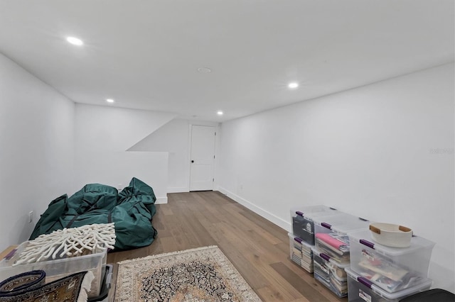 interior space with light wood finished floors, baseboards, and recessed lighting