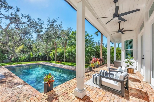 outdoor pool featuring a ceiling fan, a patio, and an outdoor living space