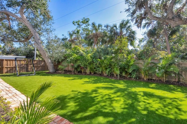 view of yard featuring a fenced backyard