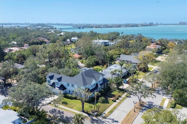 birds eye view of property featuring a water view and a residential view