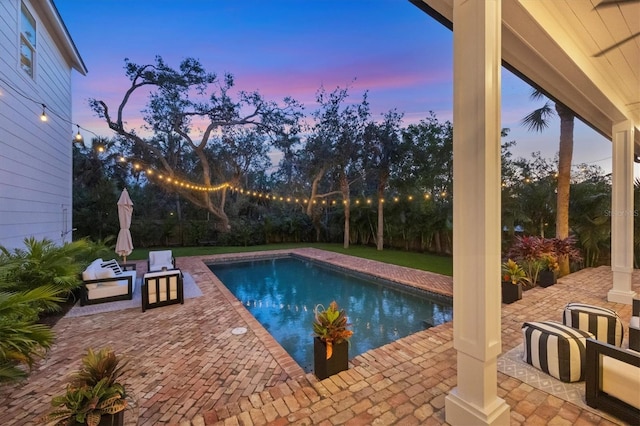 outdoor pool featuring a patio