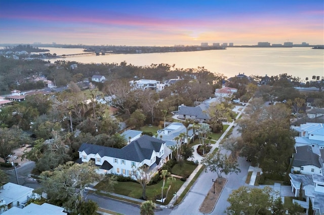 bird's eye view featuring a residential view and a water view