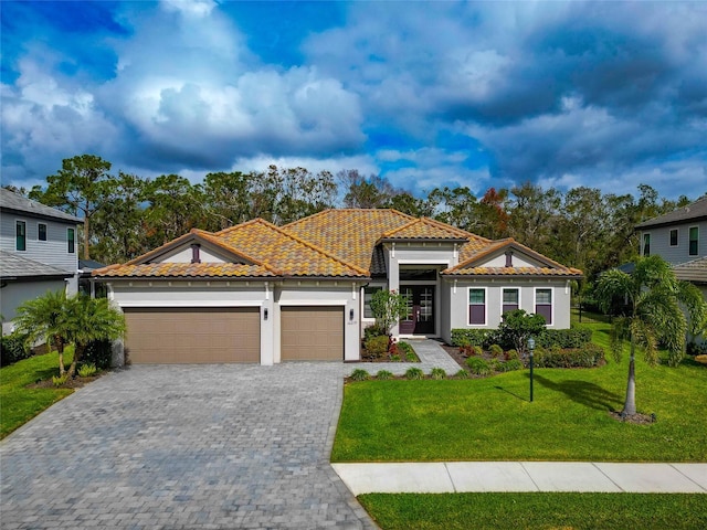 view of front facade featuring a garage and a front yard