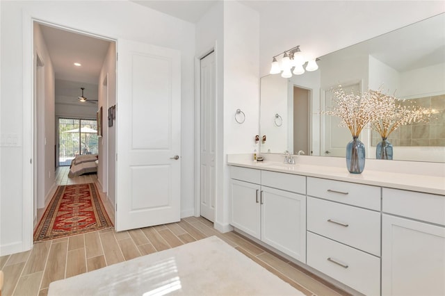 bathroom featuring vanity and ceiling fan