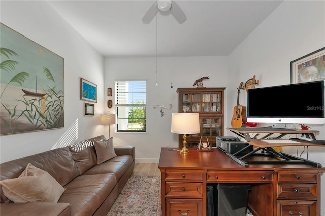 home office featuring ceiling fan and light wood-type flooring