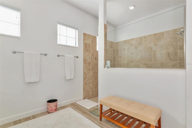 bathroom featuring a tile shower