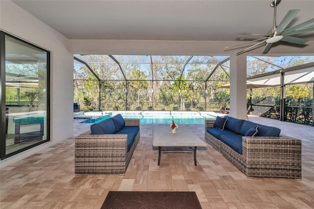 view of patio featuring a pool with hot tub, a lanai, and an outdoor hangout area