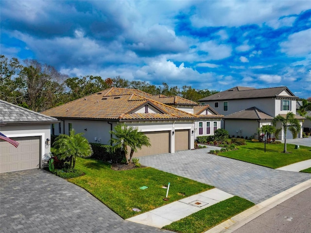 view of front of property featuring a garage and a front yard