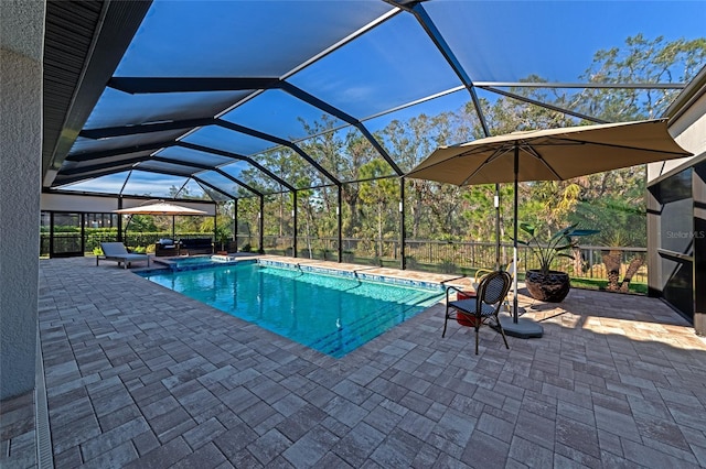 view of pool with a lanai and a patio area